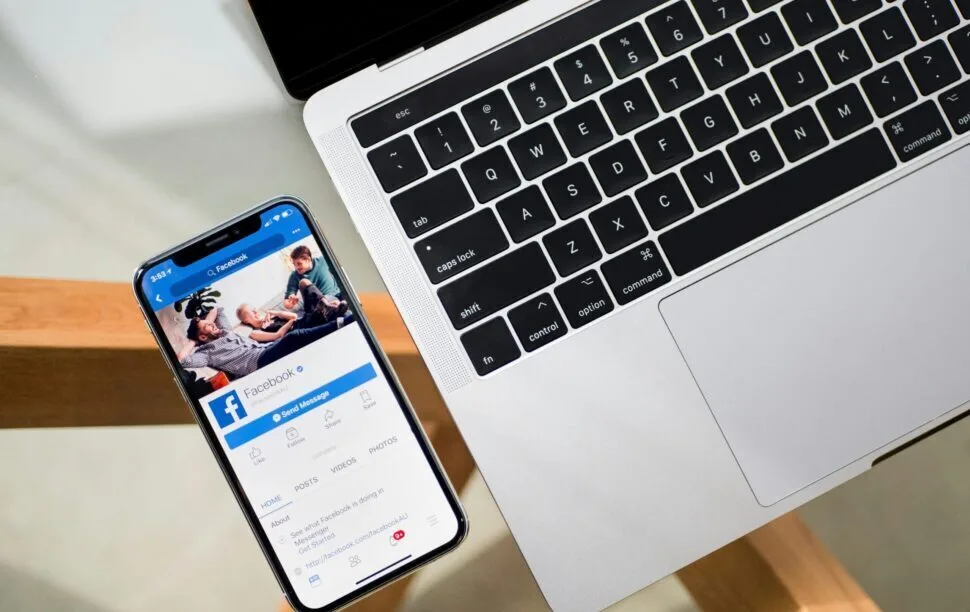 iPhone X beside MacBook